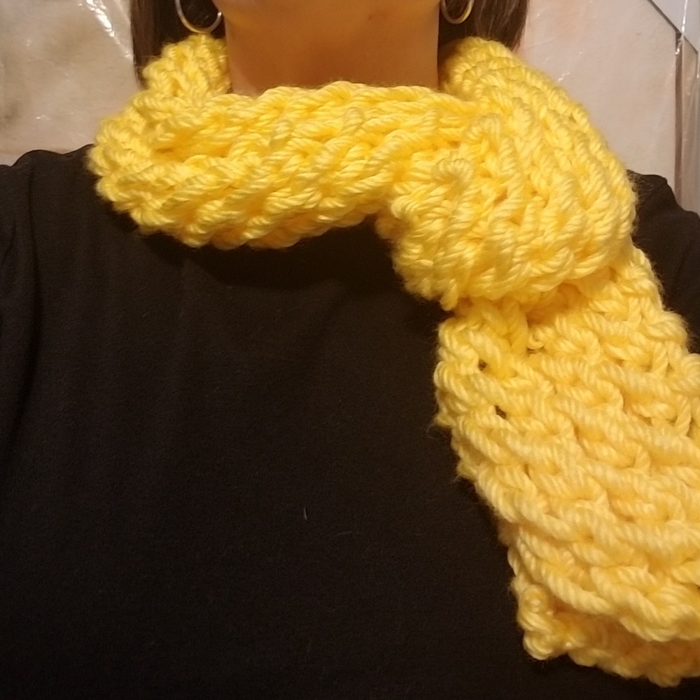 Hand knitted yellow scarf.